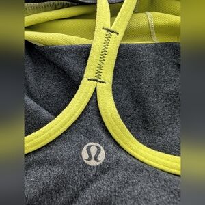 Lululemon Power Y Tank in dark gray with neon piping. 